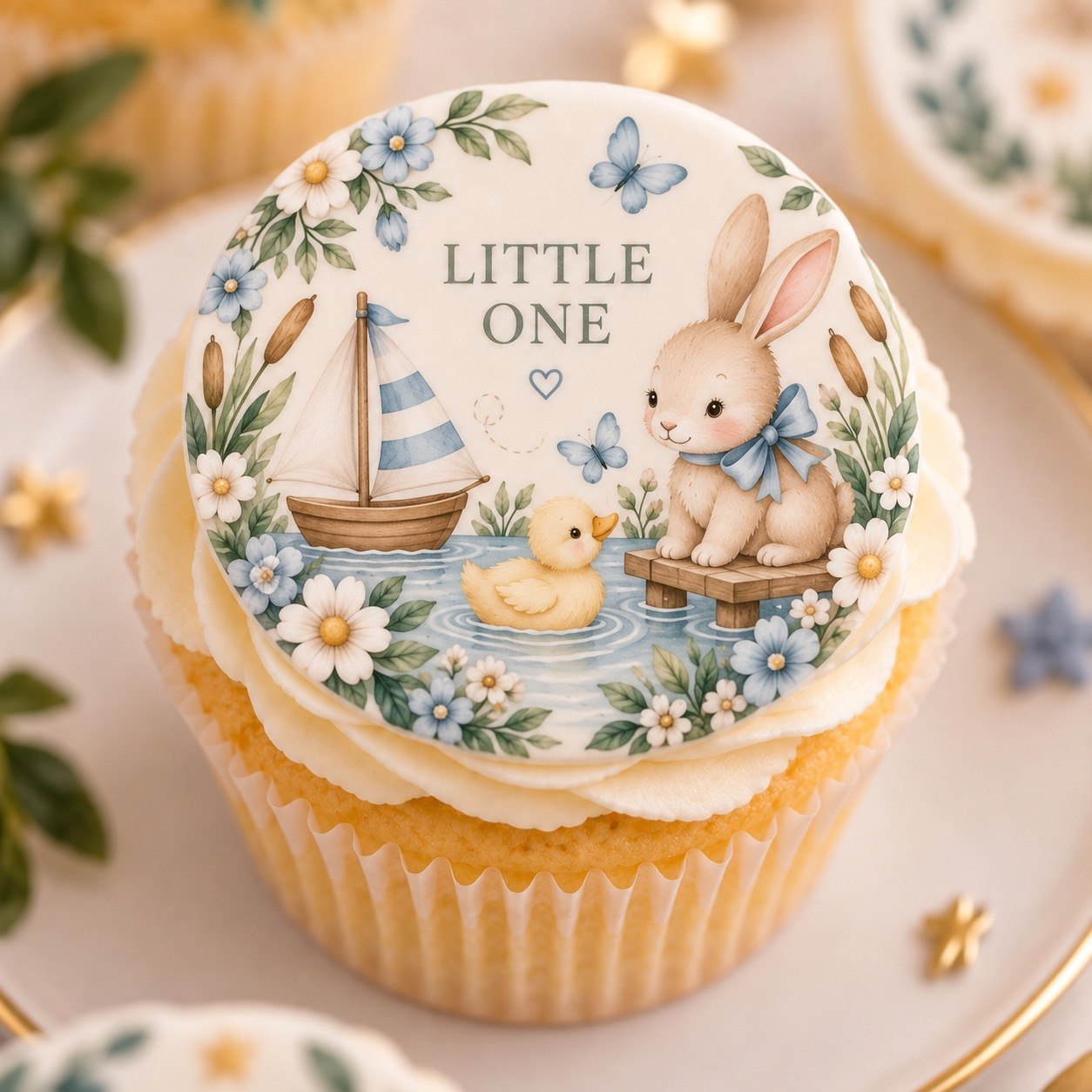 Cupcake topped with a CAKE ME fondant circle — Little One, bunny and sailboat